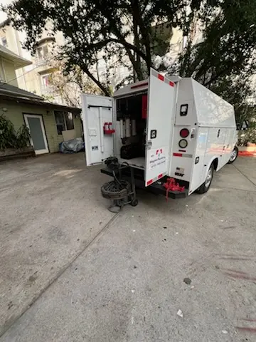 Magnet Plumbing service vehicle on-site for Grease Trap Cleaning in Ocean Bay Park